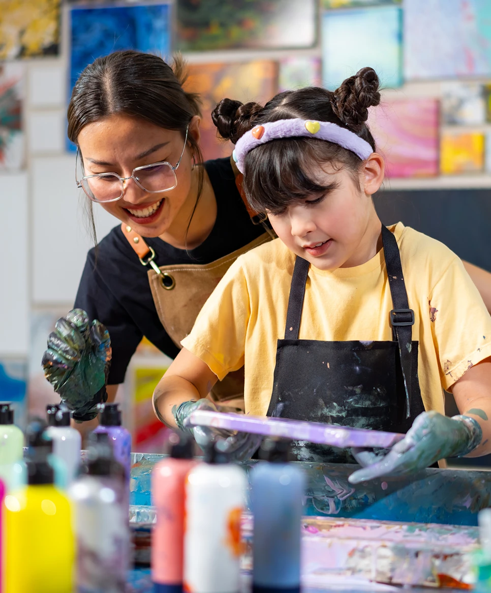 Diversity school children learning acrylic art together in art class
