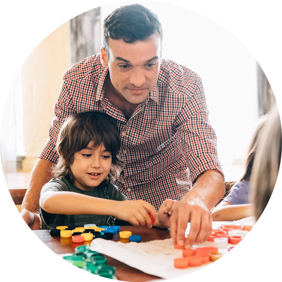 Elementary age Students working on bottle ca