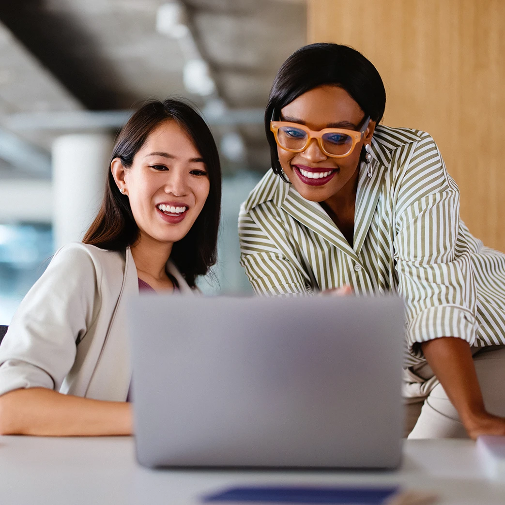 Two women working on computer